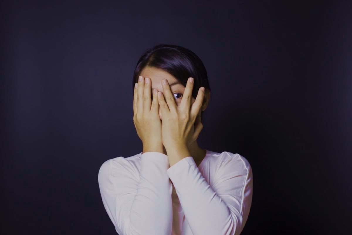 Lady looking anxious because of her dental appointment